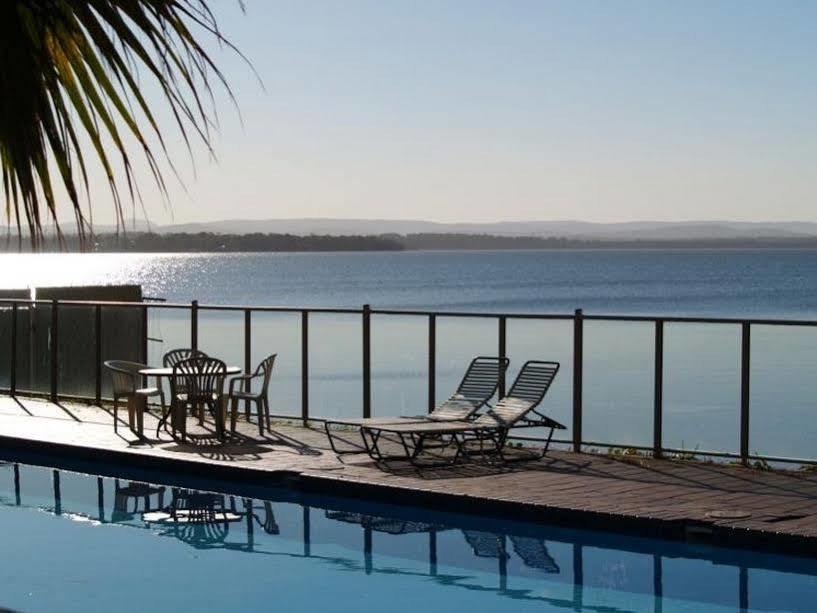 The Beachcomber Hotel & Resort, Ascend Hotel Collection Toukley Kültér fotó View of the bay from a hotel